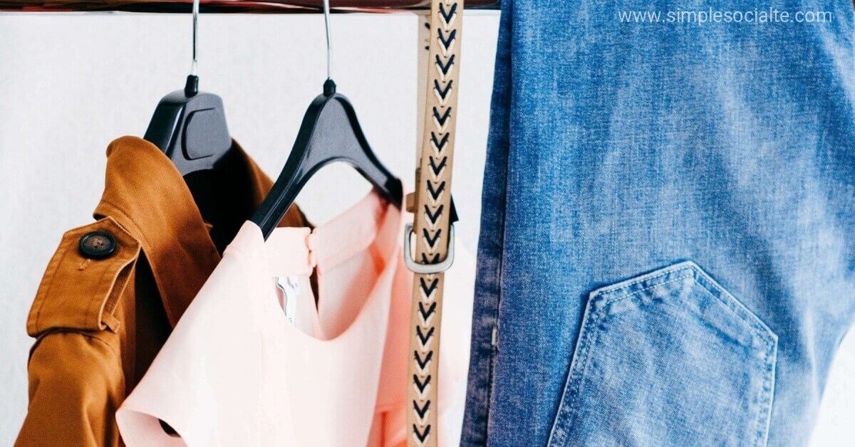 clothes hanging in an organized closet