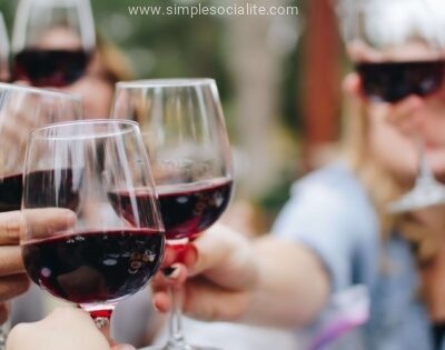 Friends cheers with glasses of red wine