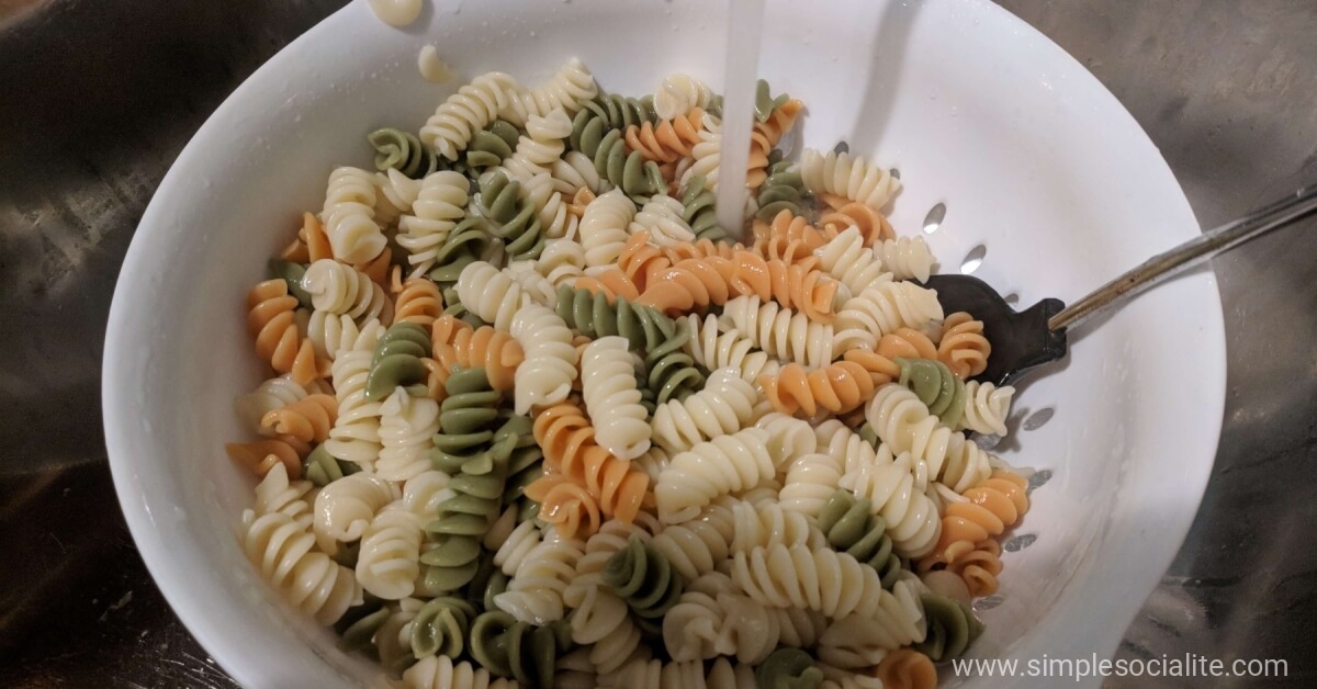 Strainer filled with rotini noodles