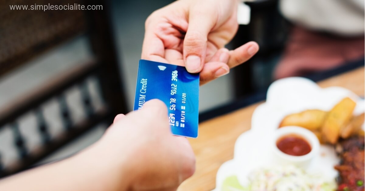 Handing Over A Credit Card To Pay Bills